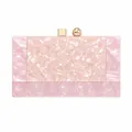 Detail of pink marble textured acrylic clutch with gold metal hardware and square clasp - Pink