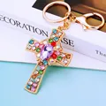 Golden cross keychain with colorful rhinestones and purple teardrop crystal pendant - Purple Crystal Cross (A792)