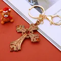 Golden cross keychain with orange and red rhinestones and lobster clasp attachment - Coffee Pearl Cross (A902)