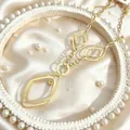Close-up of golden geometric double diamond pendant with polished and matte textures - Double-Layer Rhombus Frosted Style (2382 Gold) / Gold