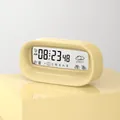 Modern digital alarm clock in cream with LCD display showing weather and temperature - Milkshake Yellow (Battery Version)