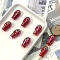 Detailed view of handmade red fish ceramic beads for jewelry DIY crafts and accessories - Red