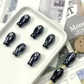 Macro view of fish-shaped black ceramic loose beads for DIY jewelry making accessories - Black
