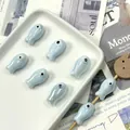 Close-up of light blue ceramic fish-shaped beads for handmade DIY jewelry and craft - Light Lake Blue