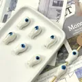 Fish-shaped ceramic beads with blue evil eye pattern for DIY jewelry making - White