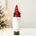 Detailed view of red gnome wine bottle cover with reindeer antlers for Christmas decor - Rudolph Style