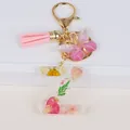 Detail of letter Z keychain with dried daisy, gold foil, pink tassel and butterfly - Letter Z