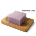 Square purple gromwell soap handmade with goat milk on a rustic wooden soap tray - Gromwell Soap