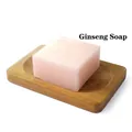 Pink translucent ginseng soap bar on a natural bamboo soap dish holder - Ginseng Soap