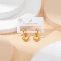 Golden stainless steel hoop earrings with 3D heart-shaped charms on display stand - Heart Pendant / Gold