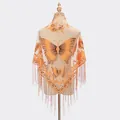 Orange lace triangle shawl with butterfly floral embroidery and fringe trim on a mannequin - Orange