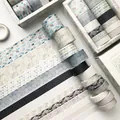 Multi-roll geometric washi tape set in grey, blue, and beige for DIY journaling - Geometric