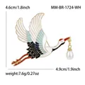 Detail view of red-crowned crane brooch with measurements 4.6cm x 4.9cm and 7.6g weight - White