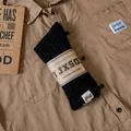 Retro black ribbed cotton crew socks with kraft paper band on a vintage brown shirt background - Black With Cloth Label / Couples' Sizes Are Average 36-44
