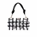 Détail du sac à main transparent en acrylique avec maille noire et fermoir doré - Noir