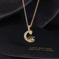 Detail of moon graduation necklace with yellow heart zircon and doctoral cap charm - Letter O