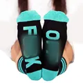 Close-up of funny knit socks featuring bold FUCK OFF letter print on the soles - One Size / Black with Green Text