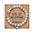 Detail of 8mm zebra stone heart bracelet on a vintage style kraft paper gift card display - With Card / Shoushan Stone with Heart