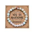 Beaded bracelet with blue marble stones and pearls displayed on a kraft quote card - 6 Artificial Pearls Style / With Card / Imperial
