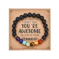 Macro view of lava stone chakra bracelet on a handmade kraft paper card holder - With Card / Multicolor Lava Stone