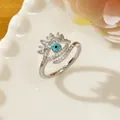 Evil Eye ring in silver finish with pavé set cubic zirconia and blue center bead - Letter R