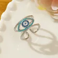 Silver evil eye ring featuring triple-layer open design with blue zircon inlay details - Letter N