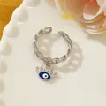 Silver chain ring with a blue evil eye pendant and micro-set cubic zirconia stones - Letter Q