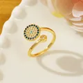 Adjustable golden evil eye ring featuring blue zircon pavé and a clear crystal stone - Letter U
