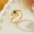 Gold evil eye open ring with blue center stone and pave zircon accents - Letter K