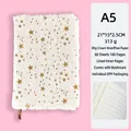 A5 white fuzzy plush notebook featuring gold star patterns and ribbon bookmark - A5 Lined Pages / Many Stars White