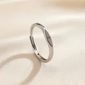 Adjustable minimalist silver metal open ring featuring a black engraved letter J - Letter J / Silver