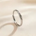 Adjustable silver ring featuring a polished oval surface with an engraved letter K - Letter K / Silver