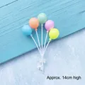 Colorful balloon cake topper with a white bow stand, approx 14cm height for party decor - Five Color Round Balloon Topper
