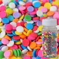 Colorful mix of round sprinkles in a jar for modern cake and dessert decoration - Colorful Round Dot Sprinkles