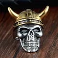 Retro viking skull ring featuring a golden horned helmet in stainless steel finish - Size 11 / Gold & Silver
