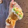 Handmade crochet flower keychain with orange petals, green leaves and pearl strap - Sunflower (with Pearl Chain)