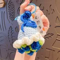Handmade sky blue crochet flower keychain with bell and decorative tag bag charm - Blue Rose (with 'Wishes Come True' Tag)