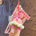 Pink handmade crochet dress keychain with bell and acrylic tag on a woven lanyard - Double Rope Pink Rose (No Troubles)