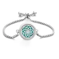 Adjustable stainless steel perfume diffuser bracelet with teal floral pattern design - Geometric Floral Hollow / Screw Twist Opening