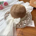 Straw sun hat with white lace embroidery and a large mesh bow for summer beach vacation - M (56-58cm) / Pearl White Lace - Khaki