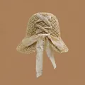 Brown straw sun hat featuring a wide brim and decorative beige lace bow on the back - M (56-58cm) / Bow Tie - Beige