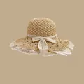 Straw sun hat with wide brim, delicate white lace trim and an elegant bow decoration - M (56-58cm) / Hollow Ribbon - Beige