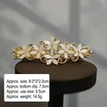 Close-up of elegant gold flower hair clip with white pearls and sparkling rhinestones - 8cm - Gold Base Cream White Curved Spring Clip