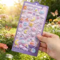 Hand holding cute 3D cartoon embossed stickers with translucent candy texture and bears - 20cm x 9.5cm / Moon Dog