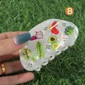 Cute acetate hair claw with colorful vegetable prints and green rhinestones in white - H854