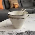 White ceramic conical bowl set with silver metallic rim and matching spoons on marble - Silver Rim 2 Bowls and 2 Spoons Set