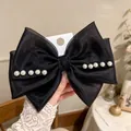 Elegant black mesh bow hair clip for girls with lustrous white pearl embellishments - Pearl Organza Ribbon / Black