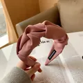 Pink wide pleated headband with twisted knot design made of durable twill fabric - Peach Pink