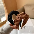 Close-up of pleated knotted headbands in black and brown textured fabric for daily wear - Dark Brown