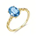 18K gold plated 925 silver ring featuring an oval blue gemstone and braided band - US 5